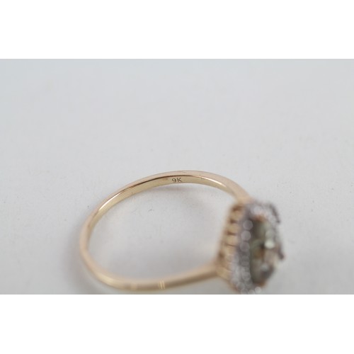 255 - 9ct gold kyanite single stone ring with diamond surround (2.5g) ring size s/t