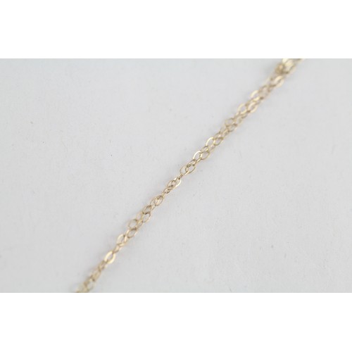 265 - 9ct gold diamond pendant & chain (0.6g)