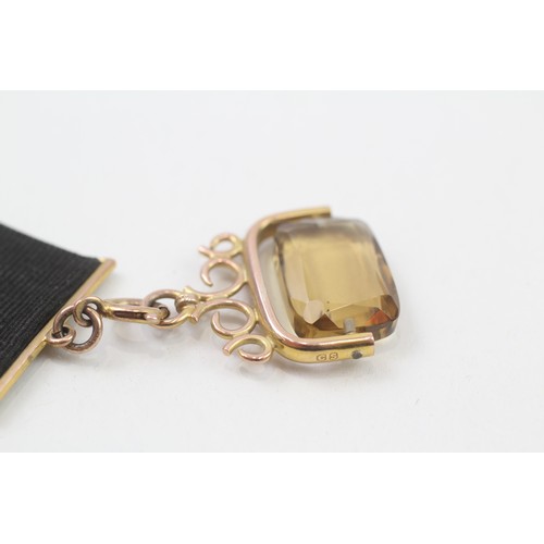 278 - 9ct gold antique citrine fob on a grosgrain extender (8.1g)