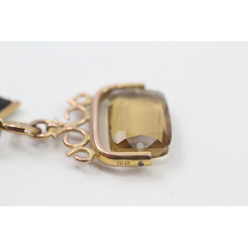 278 - 9ct gold antique citrine fob on a grosgrain extender (8.1g)