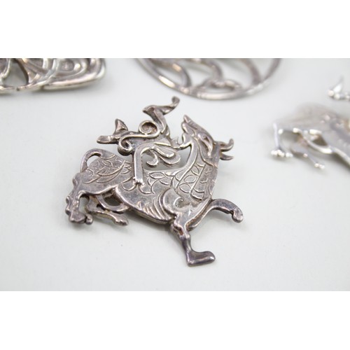 420 - Four silver Celtic brooches including Ola Gorie (53g)