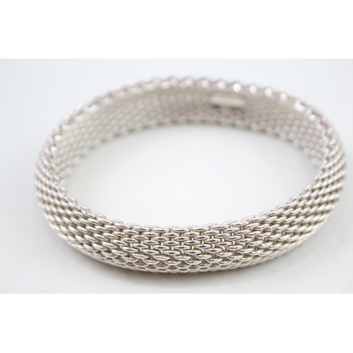 423 - Silver multi chain bracelet by designer Tiffany & Co (58g)