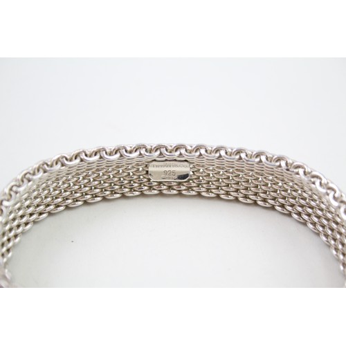 423 - Silver multi chain bracelet by designer Tiffany & Co (58g)