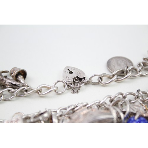 425 - Silver charm bracelet including animal charms (120g)