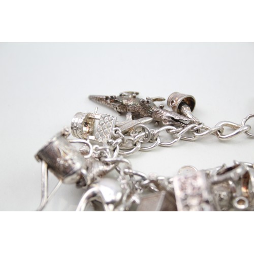 425 - Silver charm bracelet including animal charms (120g)