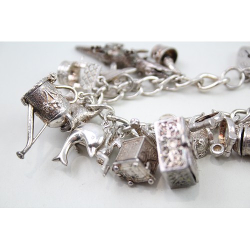 425 - Silver charm bracelet including animal charms (120g)