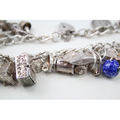 425 - Silver charm bracelet including animal charms (120g)