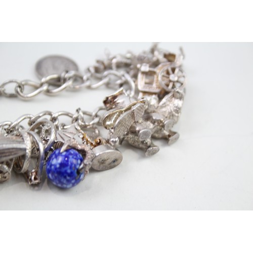 425 - Silver charm bracelet including animal charms (120g)