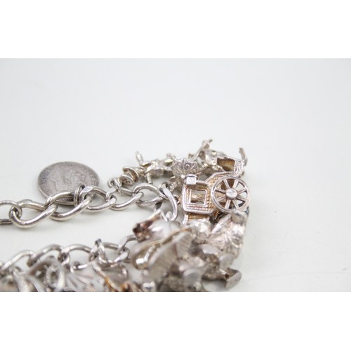 425 - Silver charm bracelet including animal charms (120g)