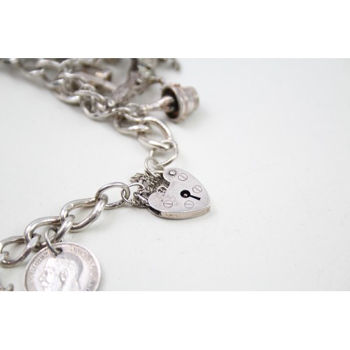 425 - Silver charm bracelet including animal charms (120g)