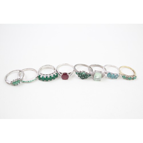 430 - A collection of silver gemstone rings including Emerald (21g)