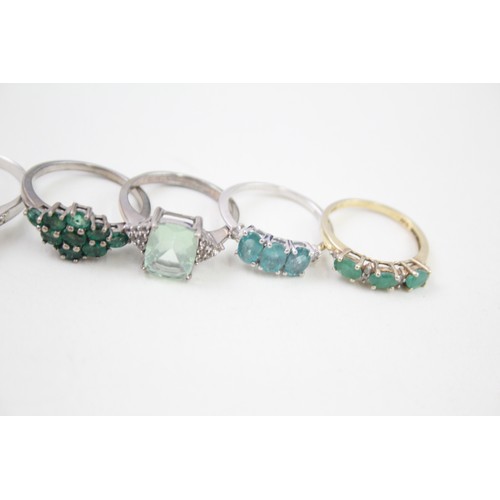 430 - A collection of silver gemstone rings including Emerald (21g)