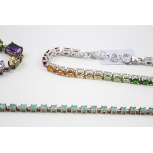 448 - Three silver gemstone tennis bracelets including Emerald (36g)