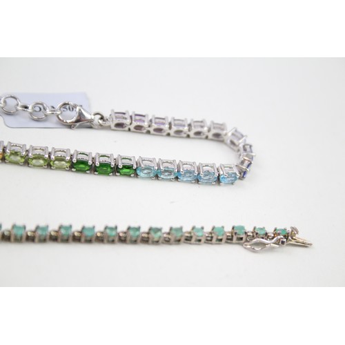 448 - Three silver gemstone tennis bracelets including Emerald (36g)