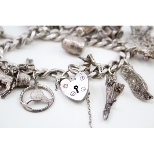 449 - Silver charm bracelet including dancer charms (88g)