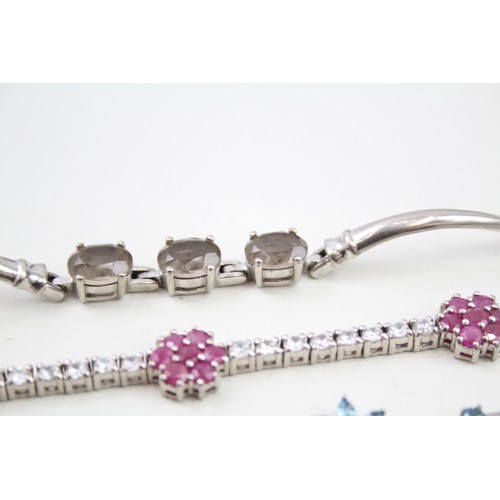 451 - Three silver gemstone bracelets including Ruby (41g)