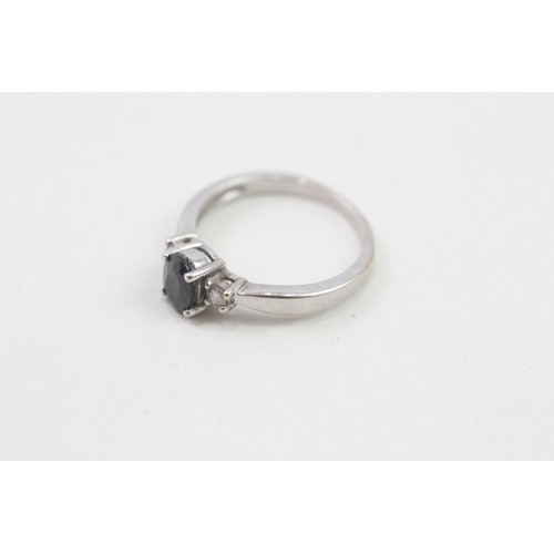 307 - 9ct white gold diamond & sapphire three stone ring (1.9g). Ring size j/k