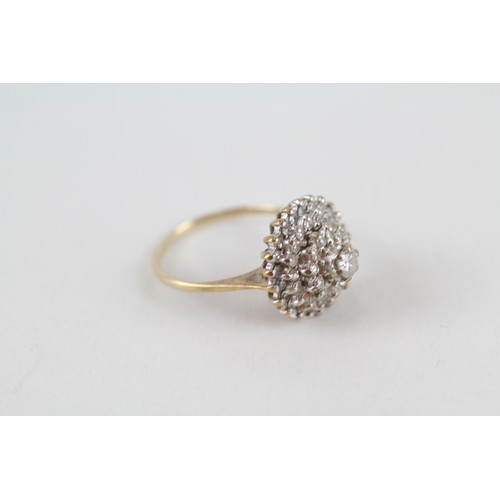 318 - 9ct gold diamond halo cluster ring (3.3g)