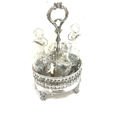 592 - Four bottle cruet set on gallery frame