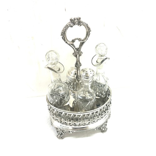 592 - Four bottle cruet set on gallery frame