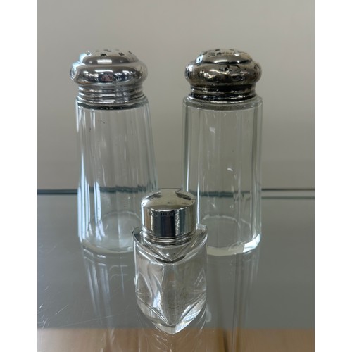 595 - Two silver topped sugar shakers and silver topped perfume