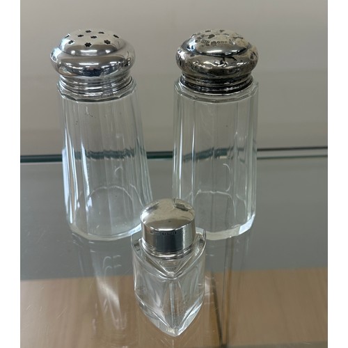 595 - Two silver topped sugar shakers and silver topped perfume