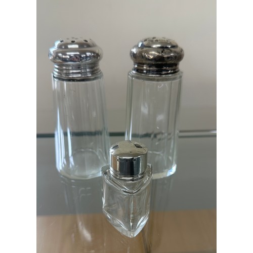 595 - Two silver topped sugar shakers and silver topped perfume