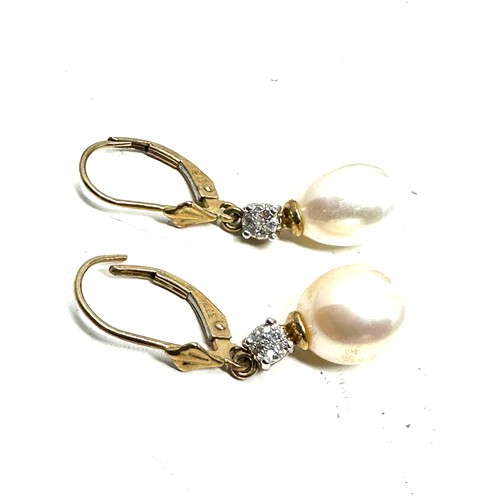 243 - 9ct gold cultured pearl & diamond drop earrings (3.2g)