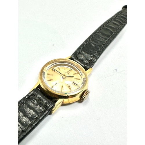 488 - ladies 9ct gold omega wrist wtach the watch is ticking