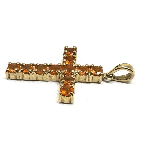 127 - 9ct gold orange citrine cross weight 2.5g