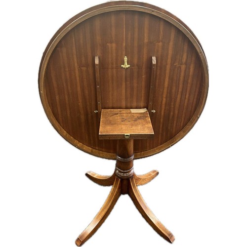 328 - Tilt top mahogany table measures 41 inches diameter 30 inches tall