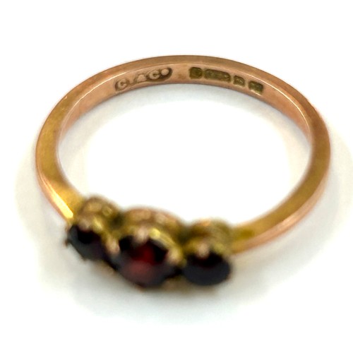 238 - 9ct gold garnet three stone ring (1.6g) ring size m/n