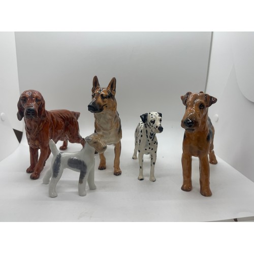 81 - 4 Royal Doulton dog figures includes Dalmatian, German Sheppard etc