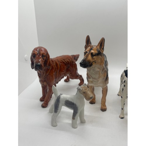 81 - 4 Royal Doulton dog figures includes Dalmatian, German Sheppard etc