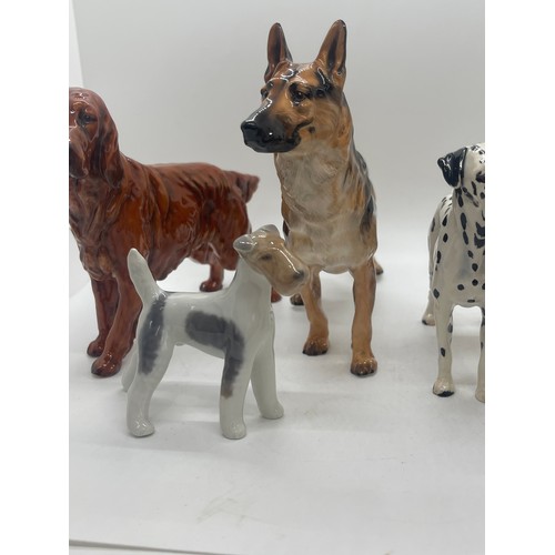 81 - 4 Royal Doulton dog figures includes Dalmatian, German Sheppard etc