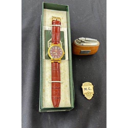 568 - Boxed MG gents wristwatch, MG Staff exhibition badge, MG Morris table lighter (engraved)