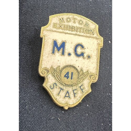 568 - Boxed MG gents wristwatch, MG Staff exhibition badge, MG Morris table lighter (engraved)