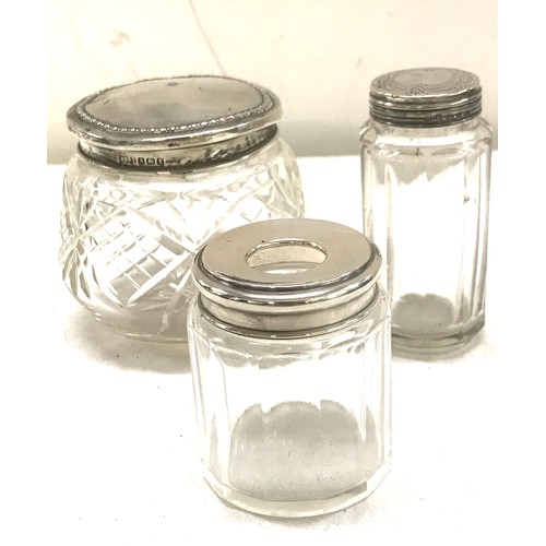 479 - 3 Hallmarked silver topped perfume jars