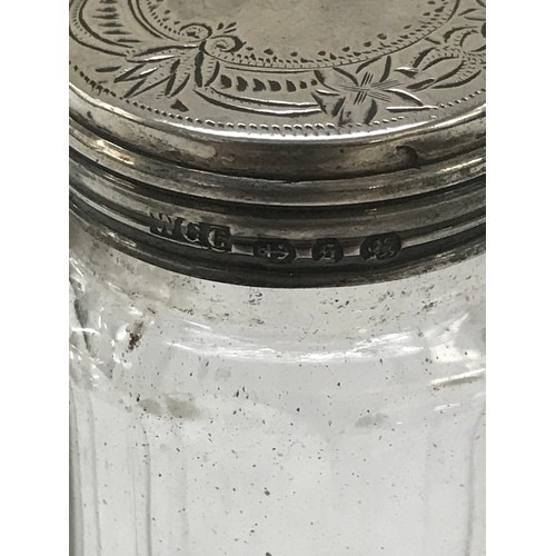 479 - 3 Hallmarked silver topped perfume jars