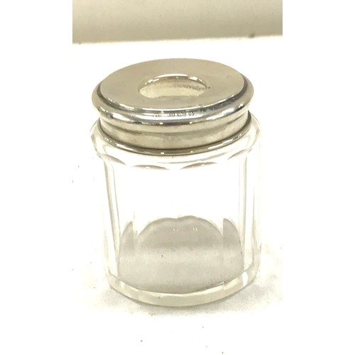 479 - 3 Hallmarked silver topped perfume jars