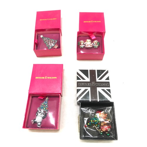 532 - Four Boxed Butler and Wilson Christmas themed brooches, 3 have never been out of the packaging