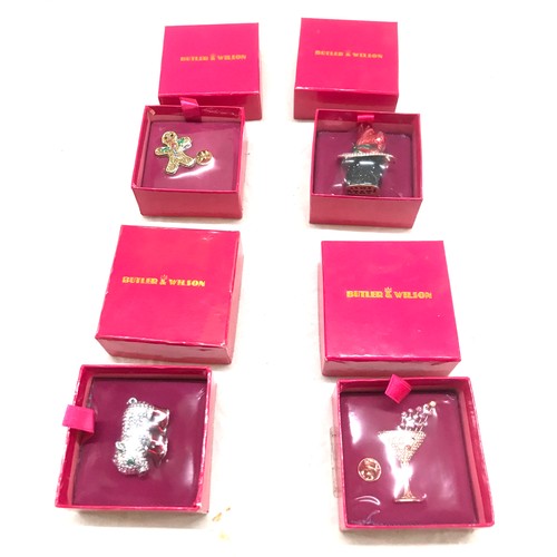 549 - Four brand new in box Butler and Wilson Brooches includes Pig, Ginger bread etc