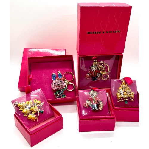 552 - Selection 5 boxed as new vintage Butler and Wilson keyrings and brooches to include a bunny, teddy b... 