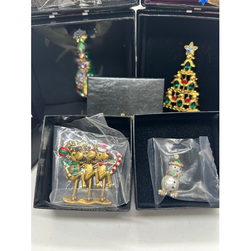 548 - Selection of Boxed vintage Butler and Wilson Christmas theme brooches to include Christmas trees, du... 