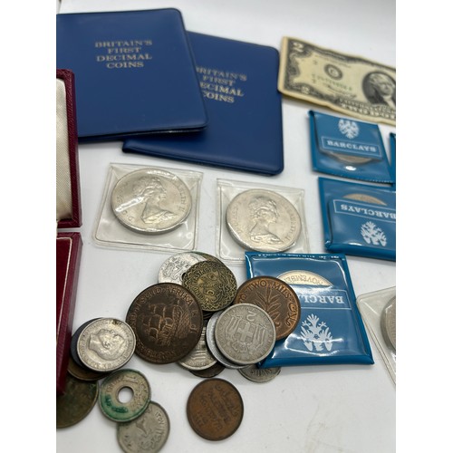 451 - Large selection of vintage and later coins to include a half dollar silver coin, decimals etc