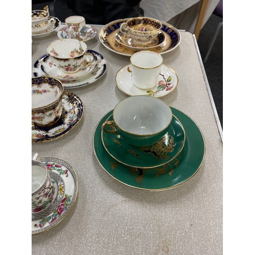 88 - Selection of assorted cups and saucers and some trio sets includes Royal Doulton, Ainsley etc