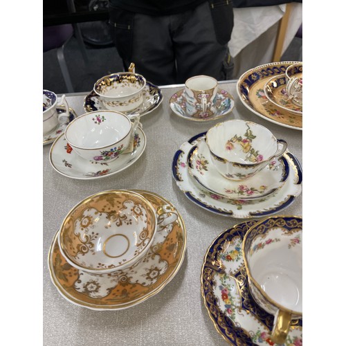 88 - Selection of assorted cups and saucers and some trio sets includes Royal Doulton, Ainsley etc