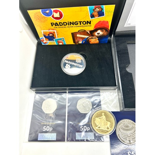 421 - Selection of english and foreign coins to include a proof £5 coin proof 2021 50p piece Paddington be... 