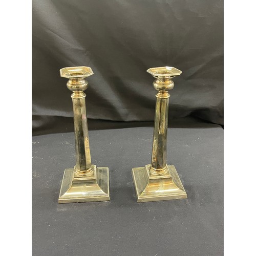 123 - Pair of silver plated candle sticks height 11 inches