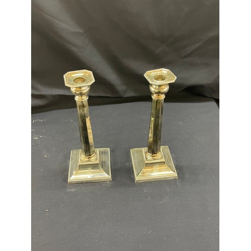 123 - Pair of silver plated candle sticks height 11 inches